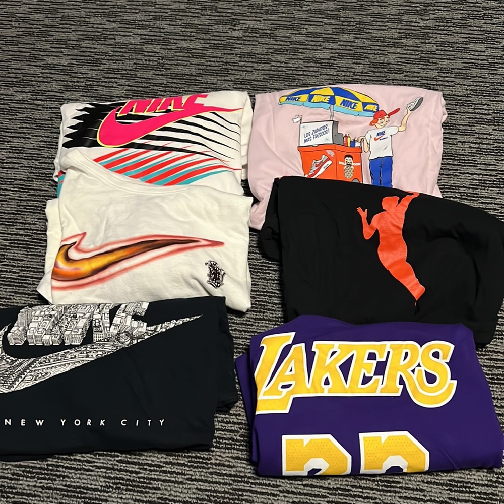 Lot of 7 nike shirts all have been worn and Fit like a Large